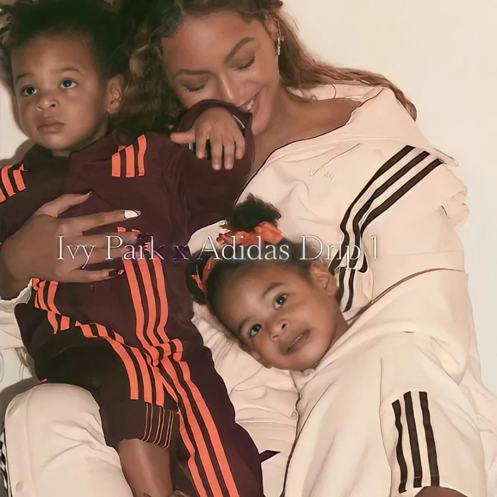 Rumi and Sir Carter playing in the park with their mother
