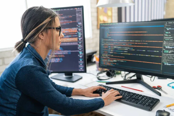 Female freelance developer coding and programming.